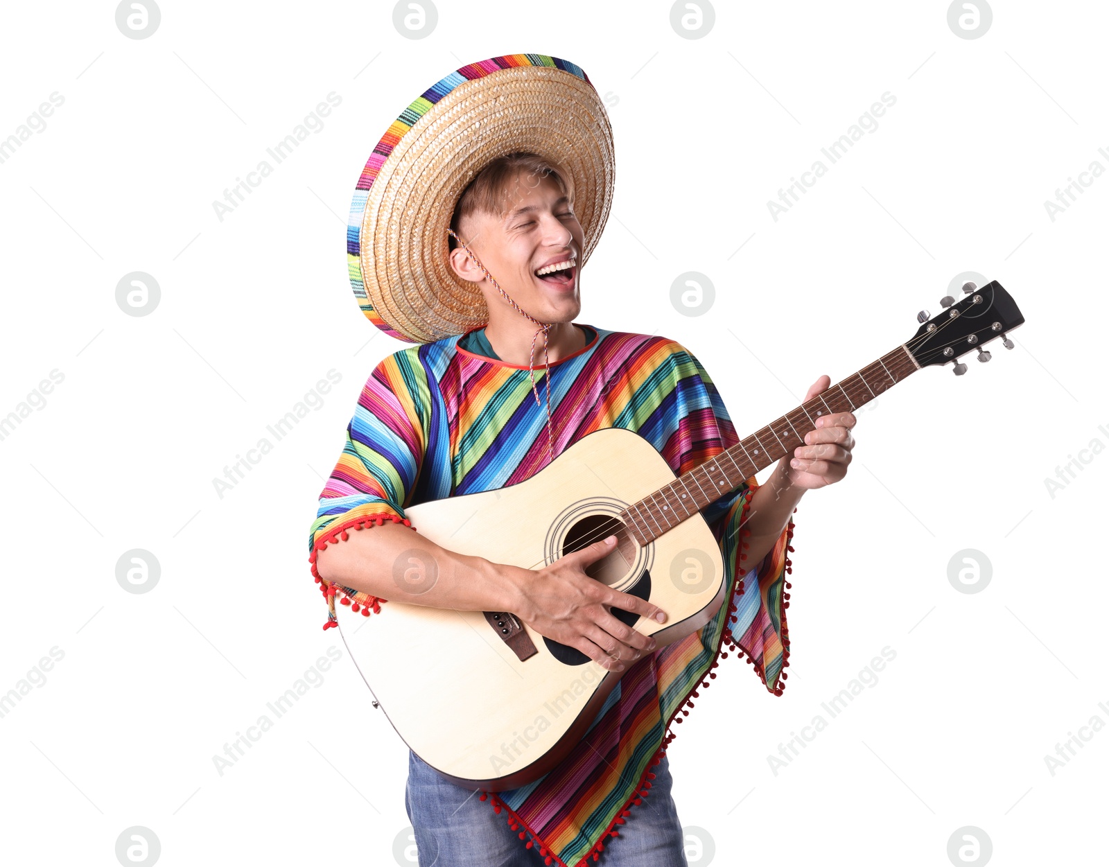 Photo of Happy man in sombrero hat and colorful poncho playing guitar on white background