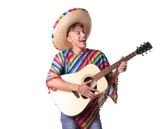 Photo of Happy man in sombrero hat and colorful poncho playing guitar on white background