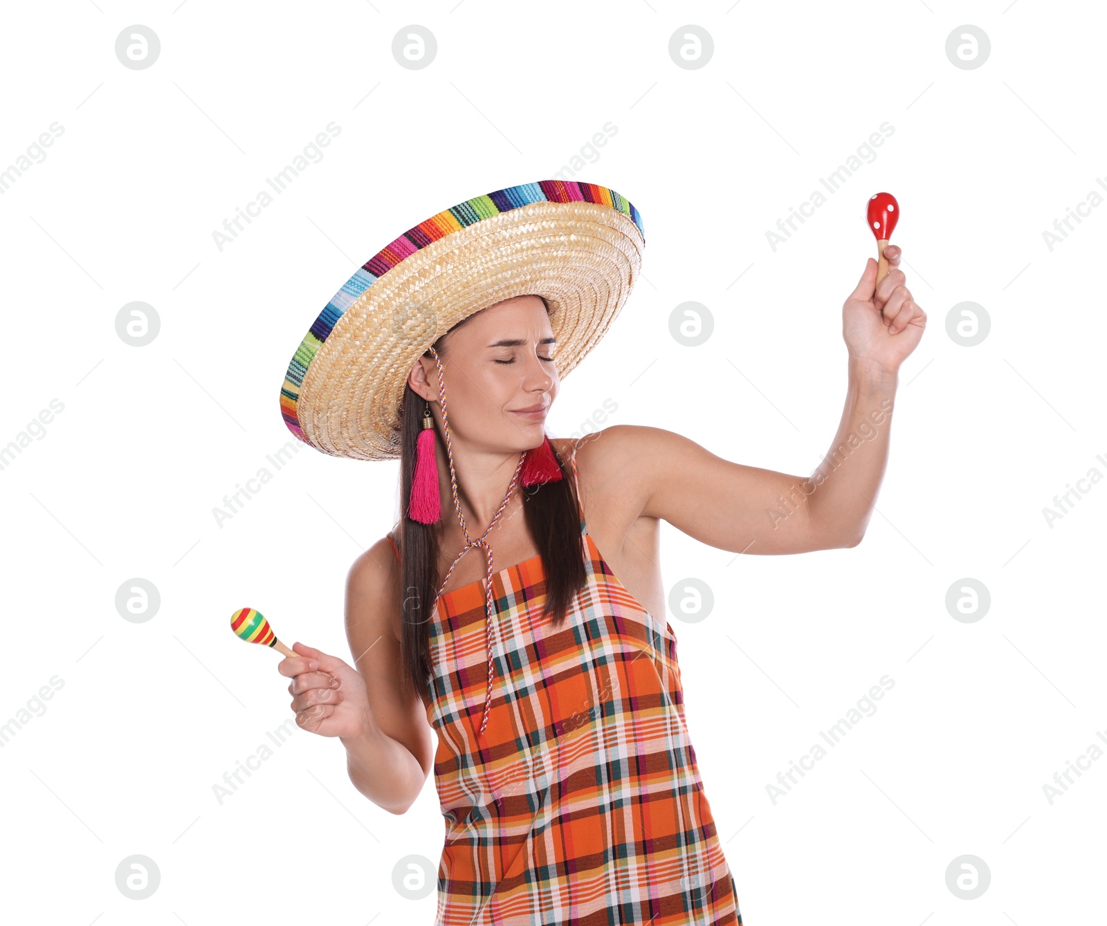 Beautiful woman in sombrero hat playing maracas on white background Photo of Beautiful woman in sombrero hat playing maracas on white background