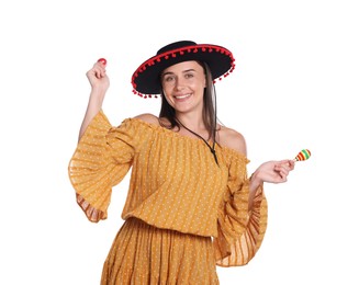 Photo of Smiling woman in black Flamenco hat and dress playing maracas on white background