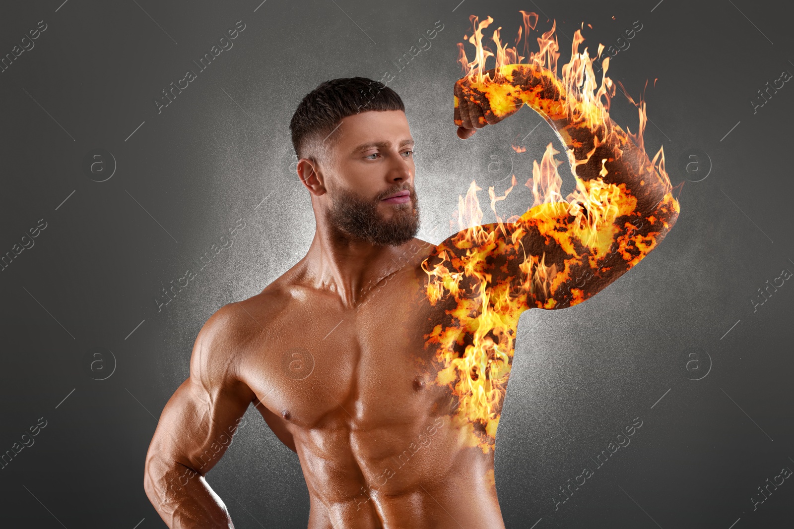 Image of Bodybuilder showing his biceps against grey background. Muscular man with flaming body