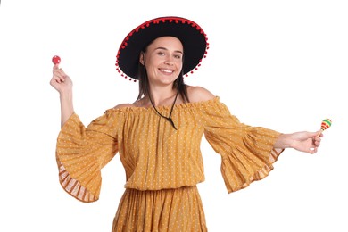 Photo of Smiling woman in black Flamenco hat and dress playing maracas on white background