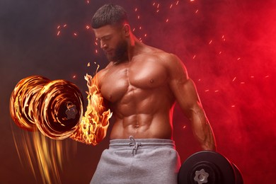 Image of Bodybuilder exercising with flaming dumbbells in smoke against dark background