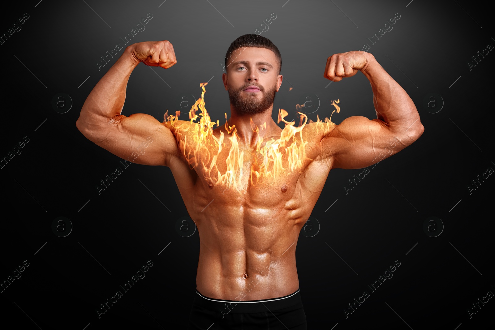 Bodybuilder showing his biceps against black background. Muscular man with flaming chest Image of Bodybuilder showing his biceps against black background. Muscular man with flaming chest