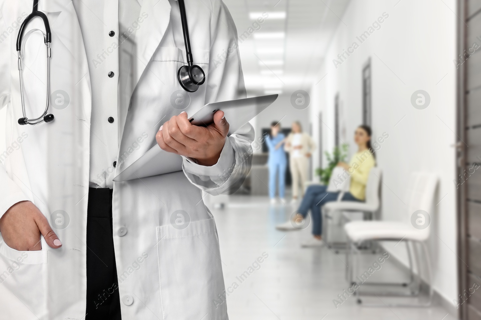 Doctor with stethoscope and happ of hospital, double exposure Image of Doctor with stethoscope and happ of hospital, double exposure