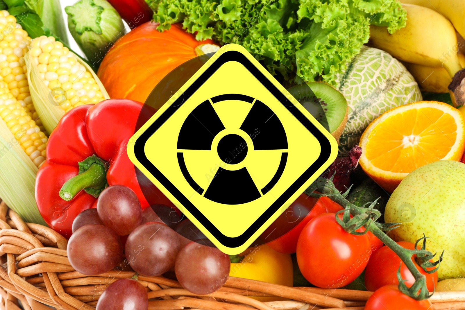 Image of Fresh vegetables, fruits and radioactive sign. Environmental contamination, polluted food