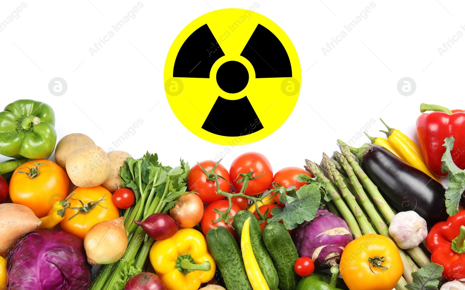 Fresh vegetables and radioactive sign on white background, top view. Environmental contamination, polluted food Image of Fresh vegetables and radioactive sign on white background, top view. Environmental contamination, polluted food