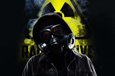 Image of Man wearing gas mask in smoke against black background. Radioactive sign behind him