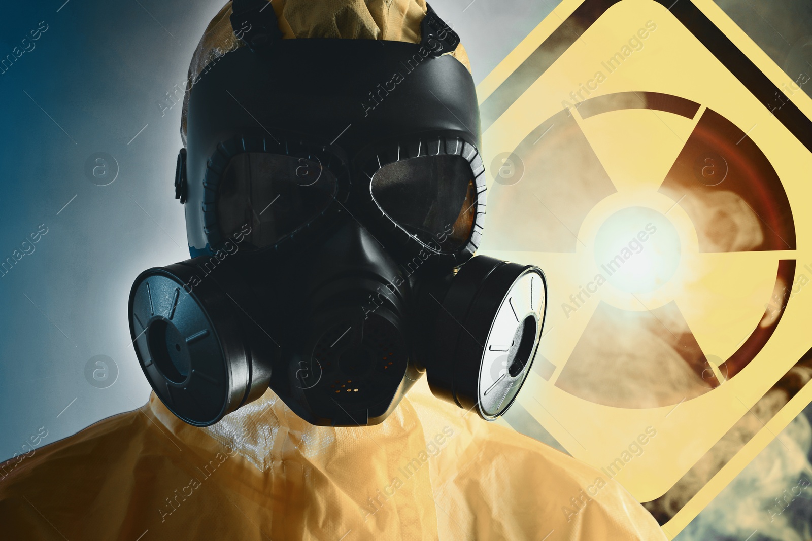 Image of Man wearing hazmat suit and gas mask in smoke. Glowing radioactive sign on color background behind him