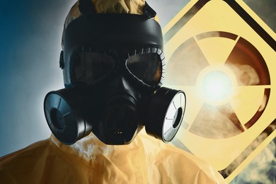 Image of Man wearing hazmat suit and gas mask in smoke. Glowing radioactive sign on color background behind him