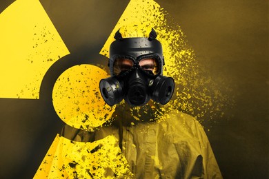 Image of Man wearing hazmat suit and gas mask on color background. Dissolving radioactive sign