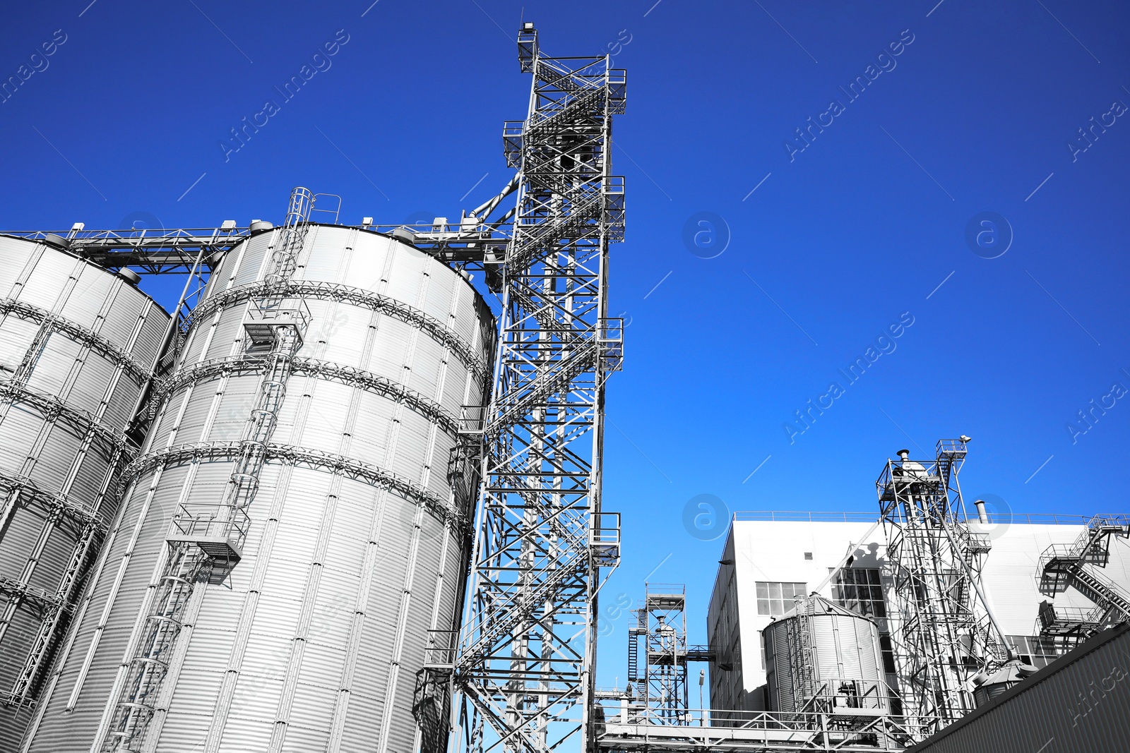 Modern granaries for storing cereal grains outdoors, low angle view Image of Modern granaries for storing cereal grains outdoors, low angle view