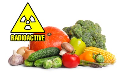 Image of Fresh vegetables and radioactive sign on white background. Environmental contamination, polluted food