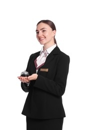 Photo of Smiling receptionist in uniform holding service bell on white background