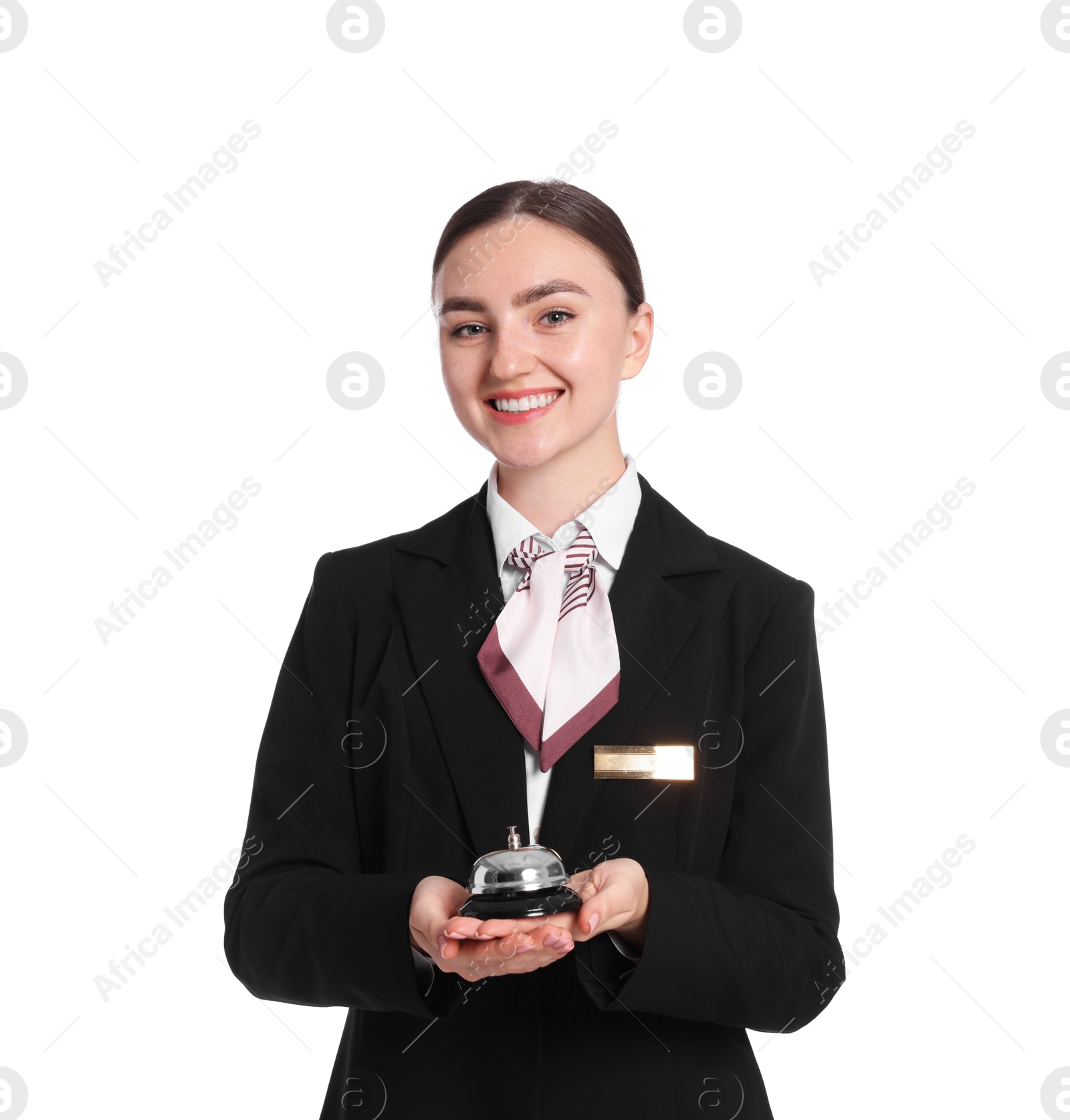 Smiling receptionist in uniform holding service bell on white background Photo of Smiling receptionist in uniform holding service bell on white background