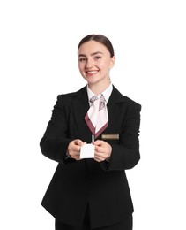 Photo of Smiling receptionist in uniform giving hotel key card on white background