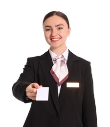 Photo of Smiling receptionist in uniform giving hotel key card on white background