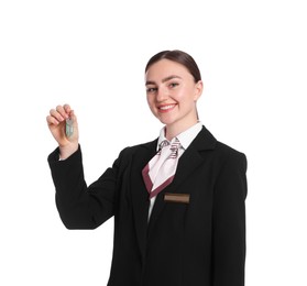 Photo of Smiling receptionist in uniform with guest room key on white background