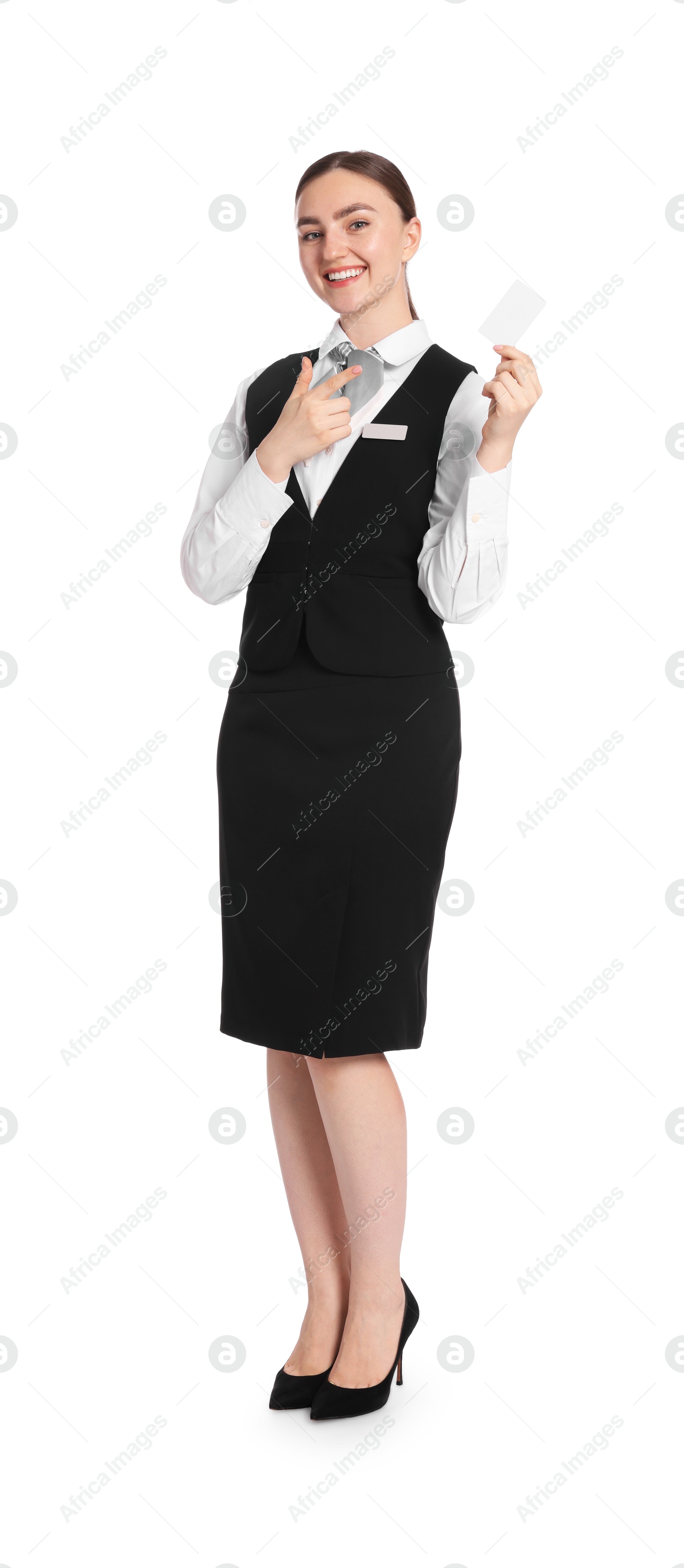 Photo of Smiling receptionist in uniform pointing at hotel key card on white background