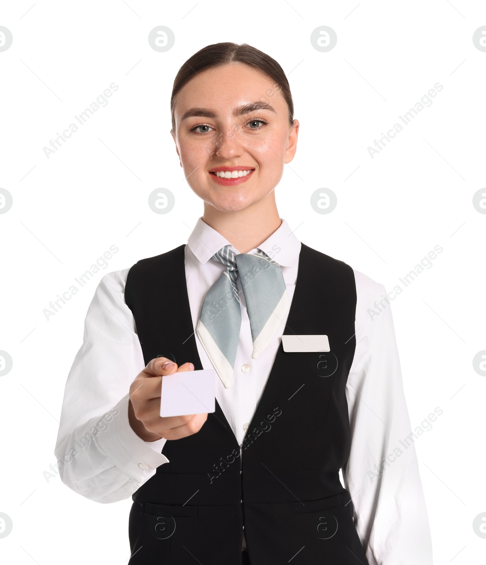 Photo of Smiling receptionist in uniform giving hotel key card on white background