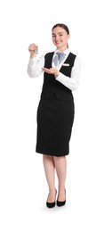 Photo of Smiling receptionist in uniform with guest room key on white background