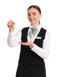 Photo of Smiling receptionist in uniform with guest room key on white background