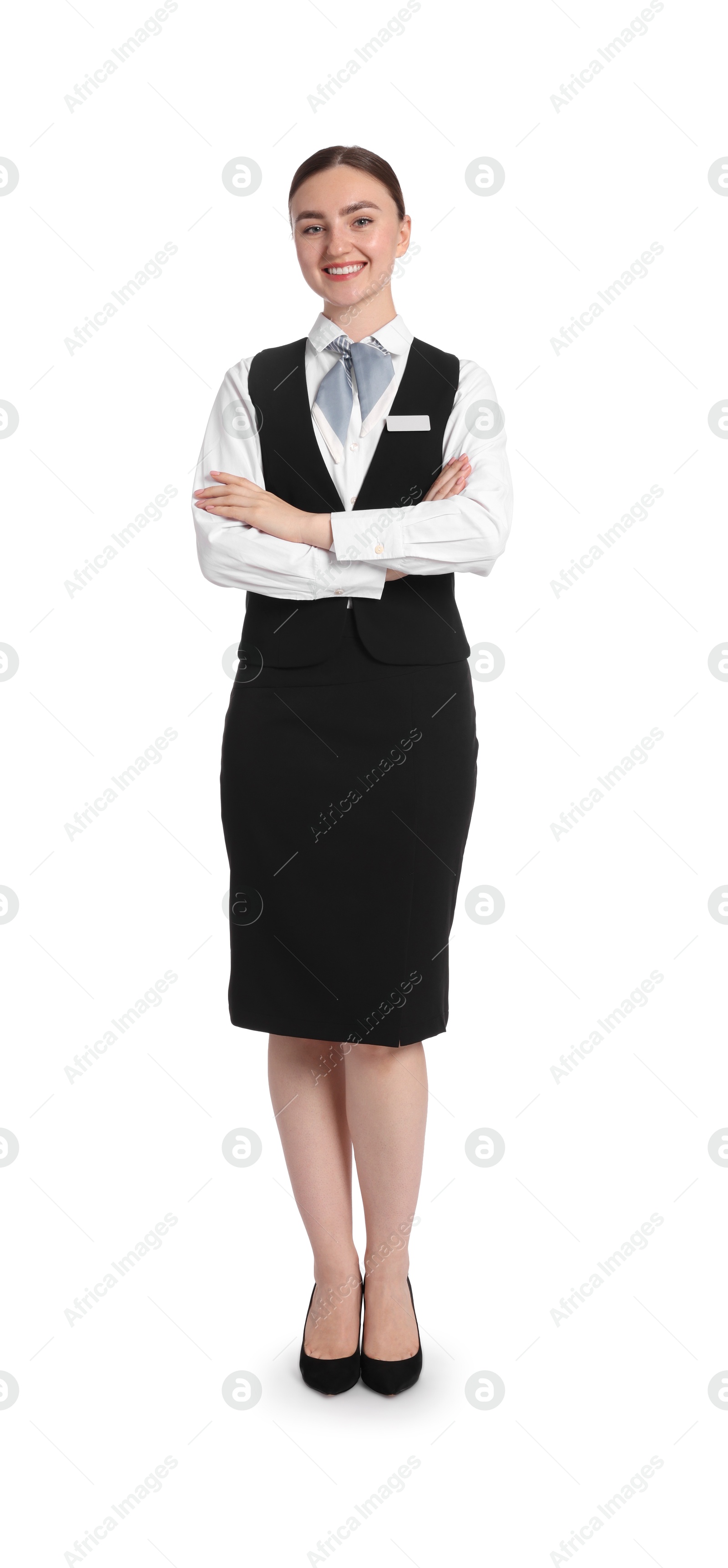 Photo of Smiling receptionist in uniform with crossed arms on white background