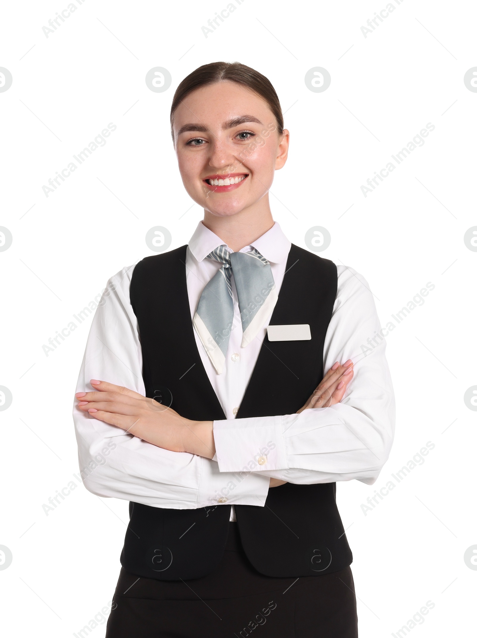 Smiling receptionist in uniform with crossed arms on white background Photo of Smiling receptionist in uniform with crossed arms on white background