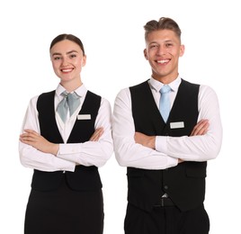 Photo of Smiling receptionists in uniforms with crossed arms on white background