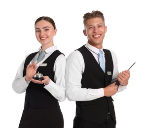 Photo of Smiling receptionists in uniforms with service bell and clipboard on white background