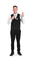 Photo of Smiling receptionist in uniform pointing at hotel key card on white background