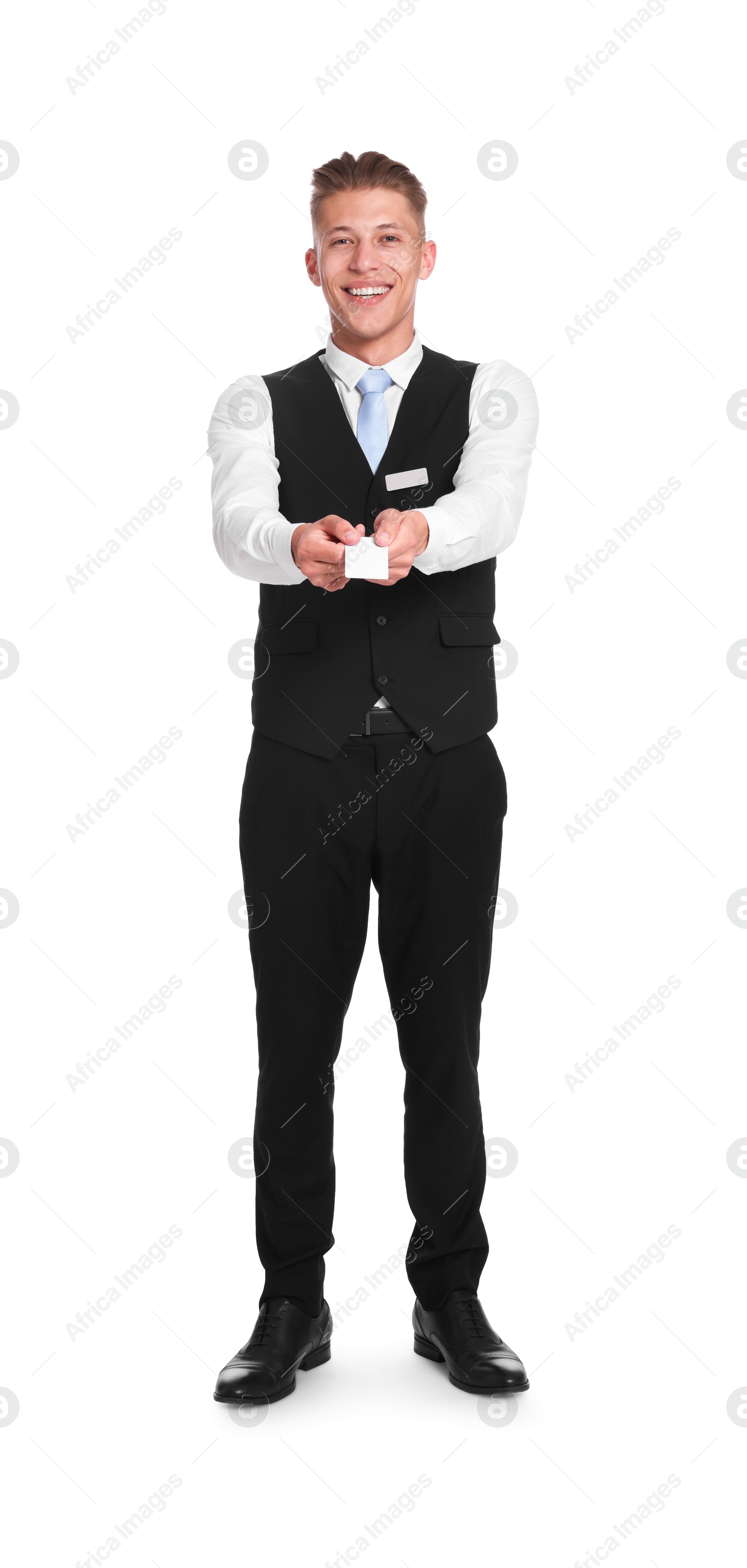 Photo of Smiling receptionist in uniform giving hotel key card on white background