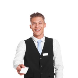Photo of Smiling receptionist in uniform giving hotel key card on white background