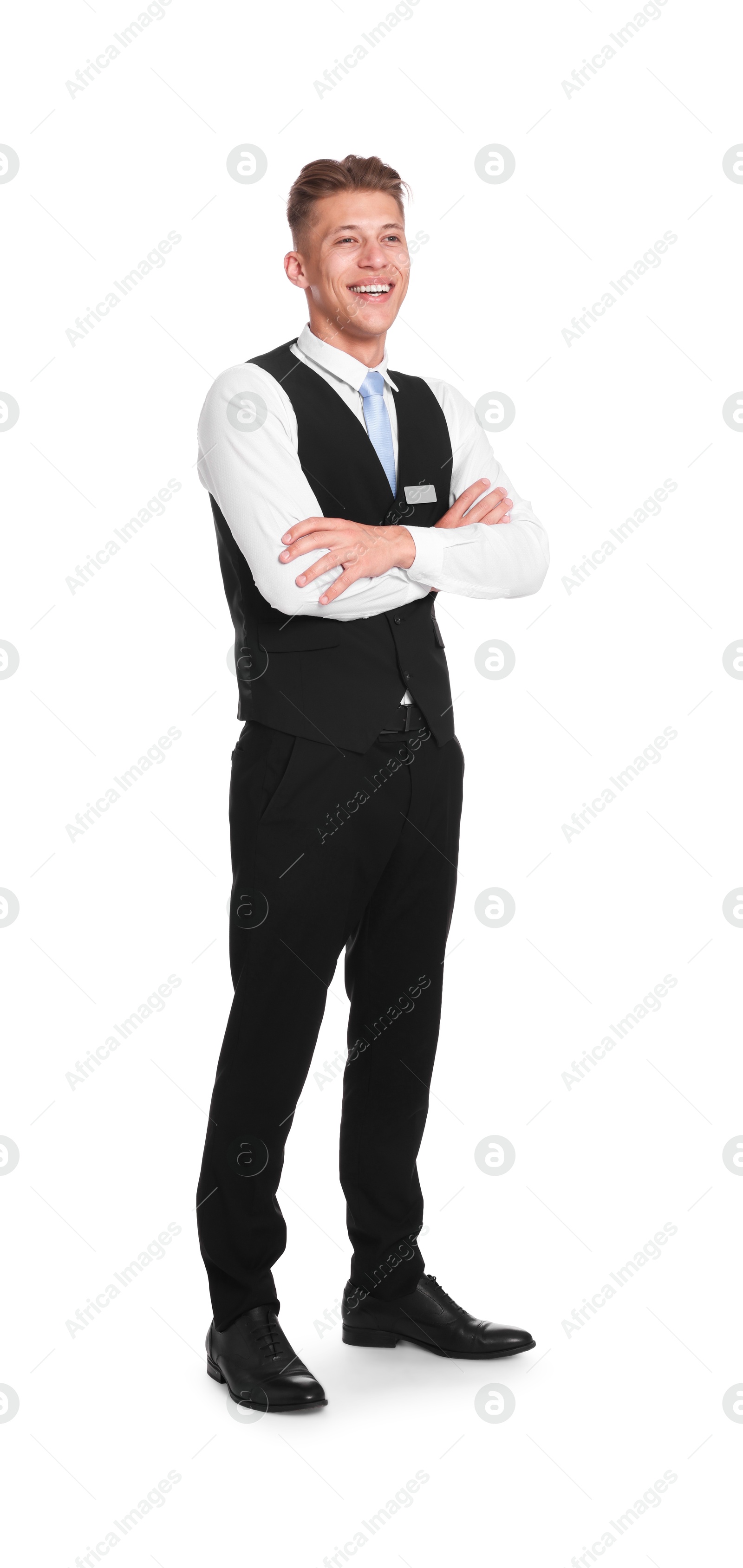 Smiling receptionist in uniform with crossed arms on white background Photo of Smiling receptionist in uniform with crossed arms on white background