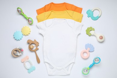Photo of Baby clothes and accessories on white background, flat lay