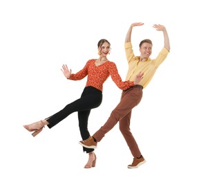 Photo of Happy couple in retro outfits dancing on white background