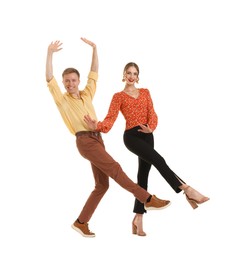 Photo of Happy couple in retro outfits dancing on white background