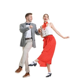 Photo of Happy couple in retro outfits dancing on white background