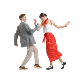 Photo of Happy couple in retro outfits dancing on white background