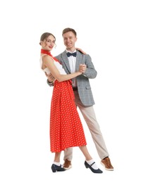 Photo of Happy couple in retro outfits dancing on white background