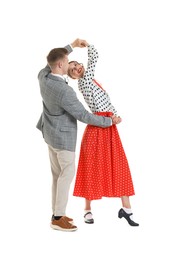 Photo of Happy couple in retro outfits dancing on white background