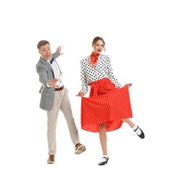 Photo of Happy couple in retro outfits dancing on white background