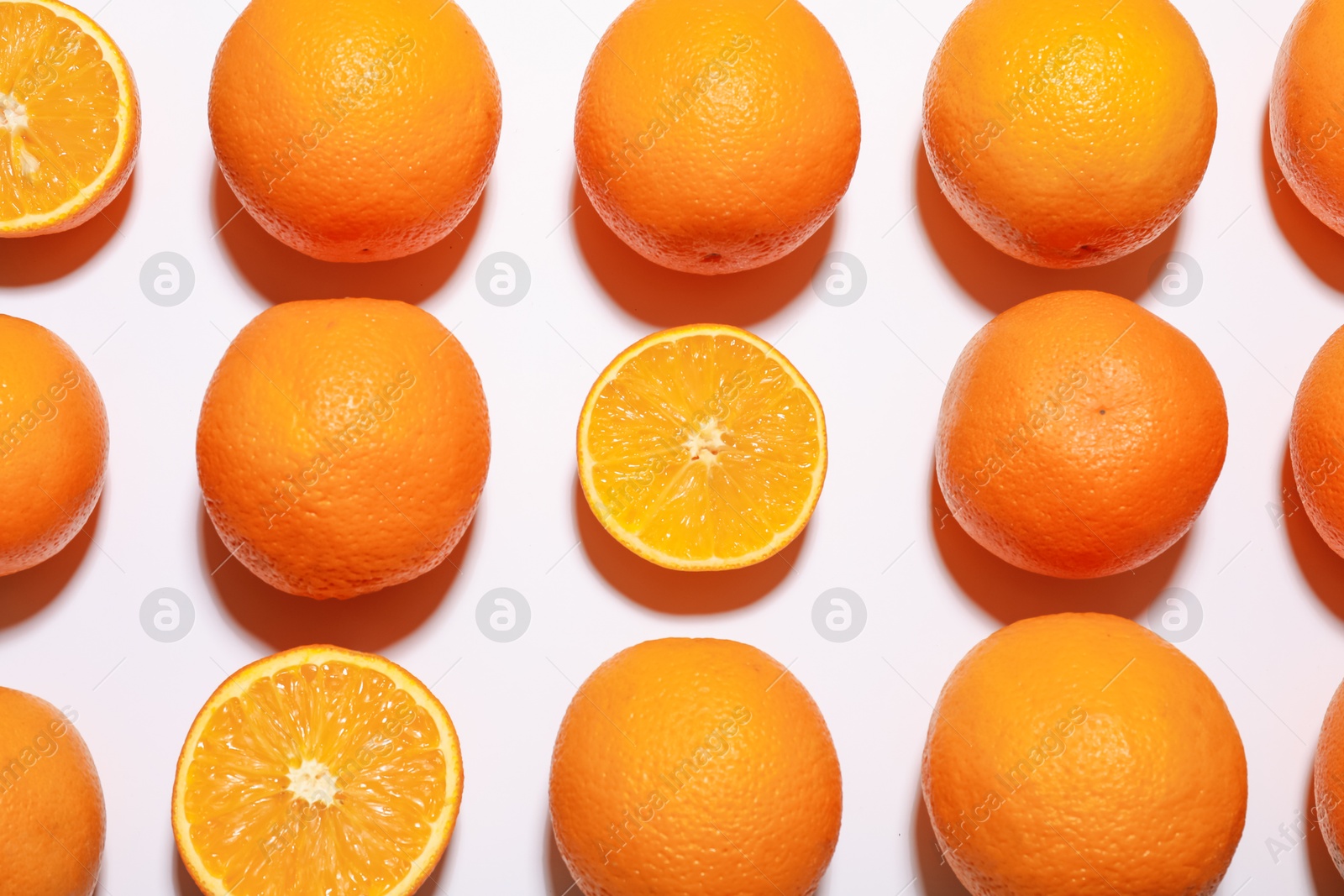 Fresh ripe oranges on white background, flat lay Photo of Fresh ripe oranges on white background, flat lay