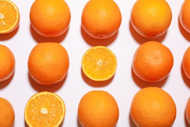 Photo of Fresh ripe oranges on white background, flat lay