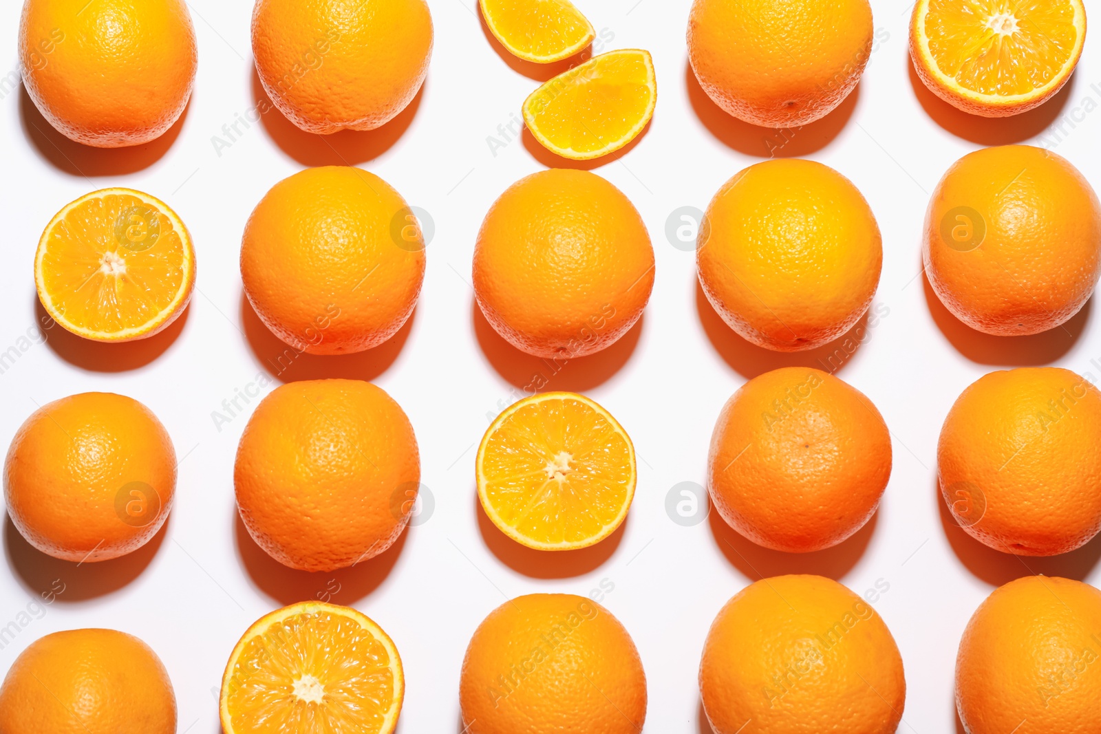 Fresh ripe oranges on white background, flat lay Photo of Fresh ripe oranges on white background, flat lay
