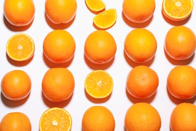 Photo of Fresh ripe oranges on white background, flat lay