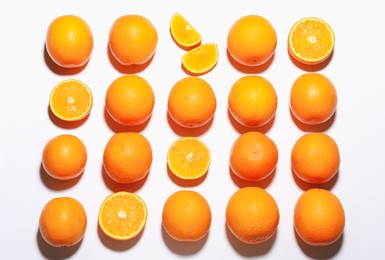 Photo of Fresh ripe oranges on white background, flat lay