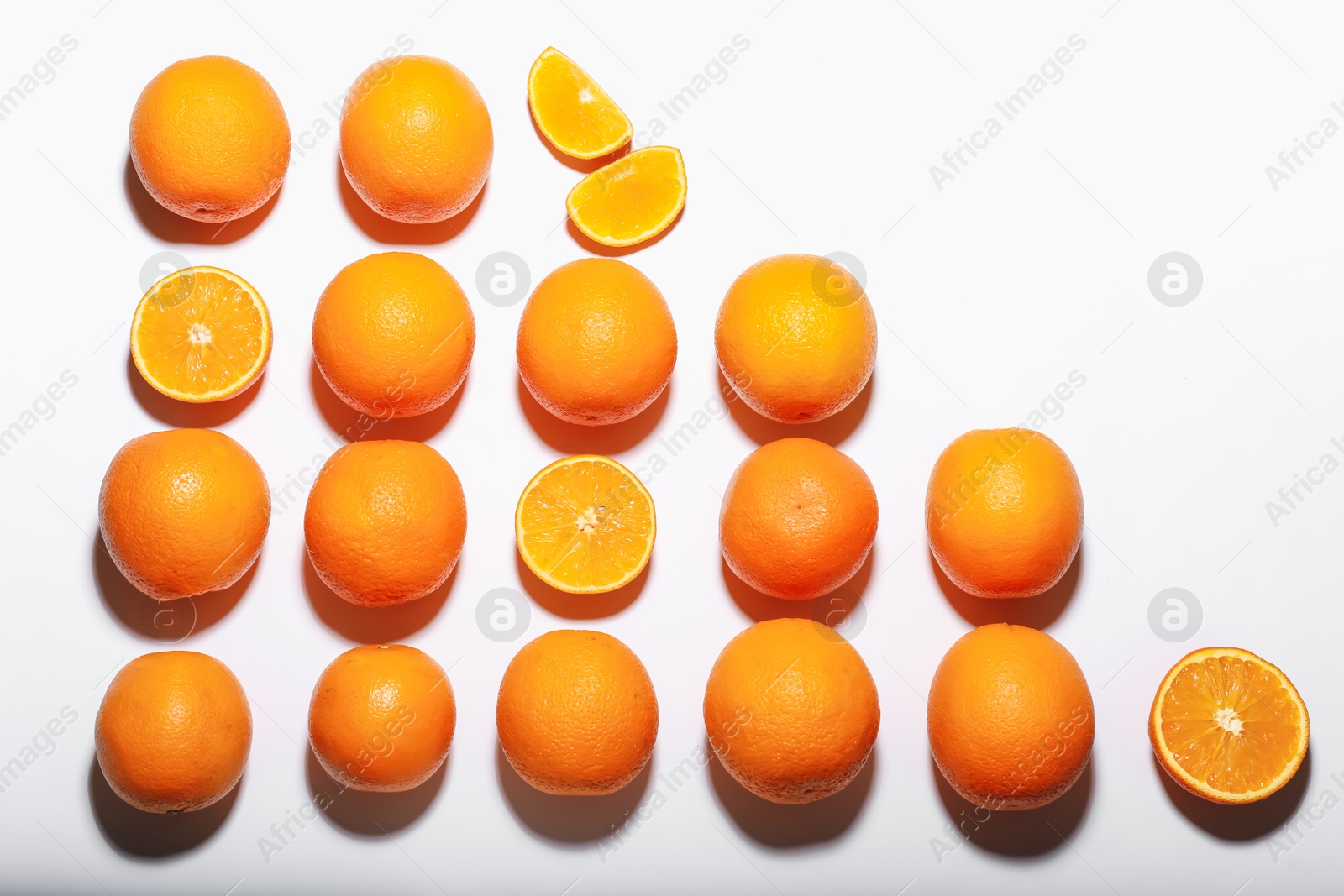 Fresh ripe oranges on white background, flat lay Photo of Fresh ripe oranges on white background, flat lay