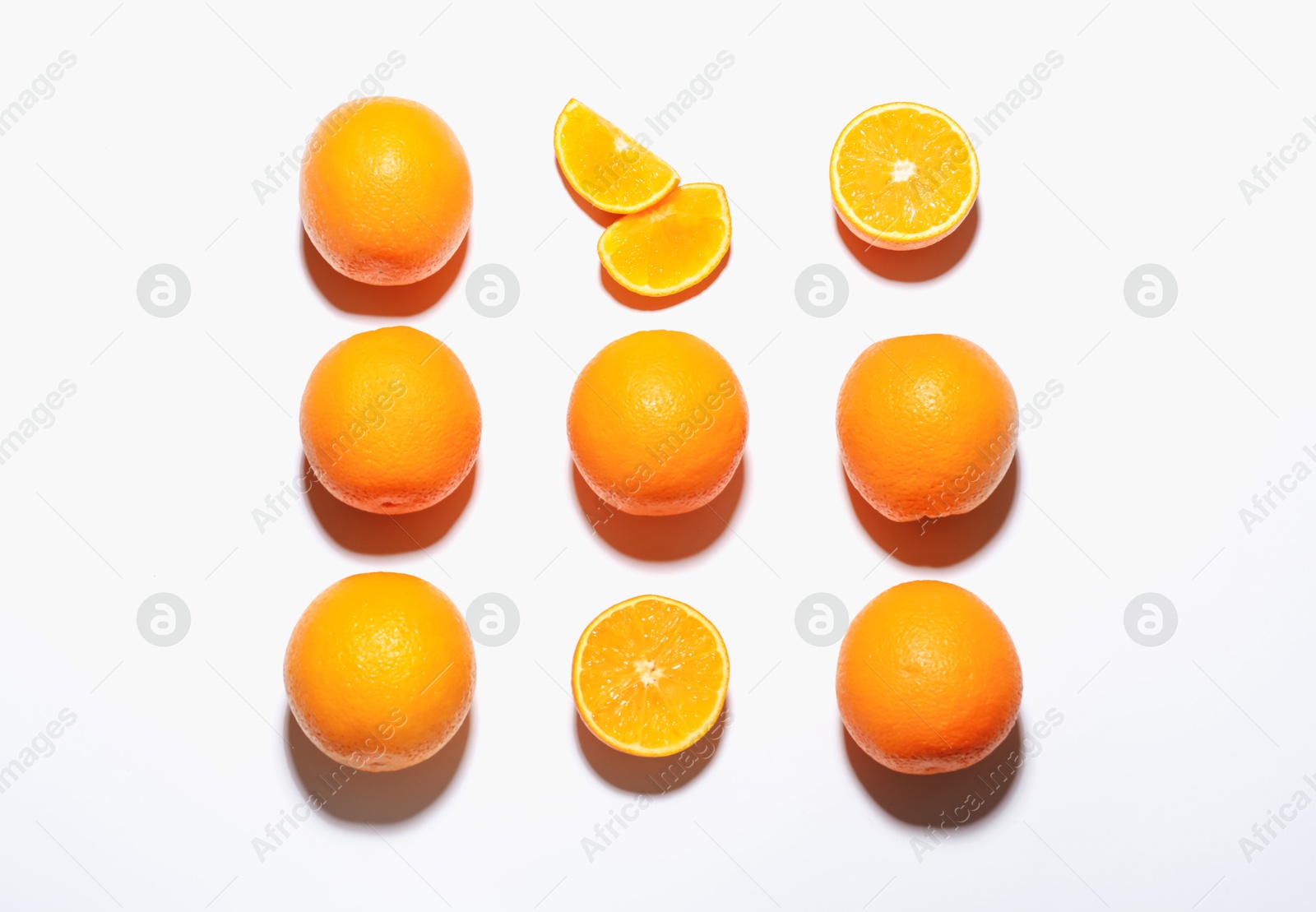 Fresh ripe oranges on white background, flat lay Photo of Fresh ripe oranges on white background, flat lay
