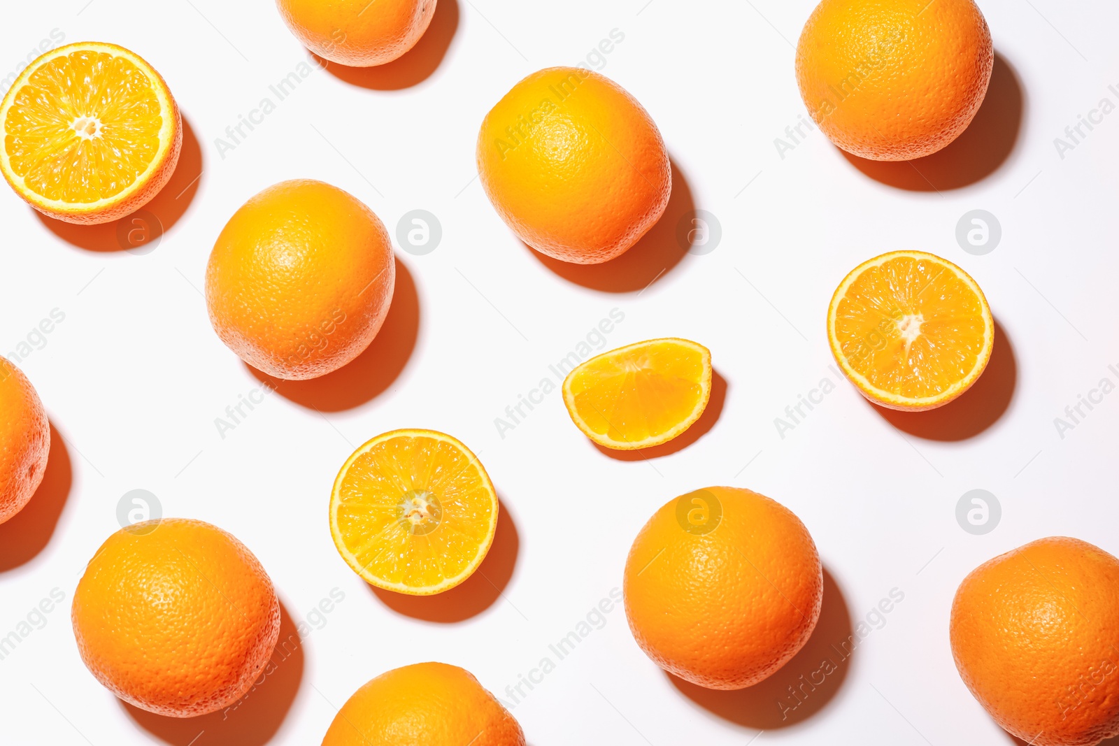 Fresh ripe oranges on white background, flat lay Photo of Fresh ripe oranges on white background, flat lay